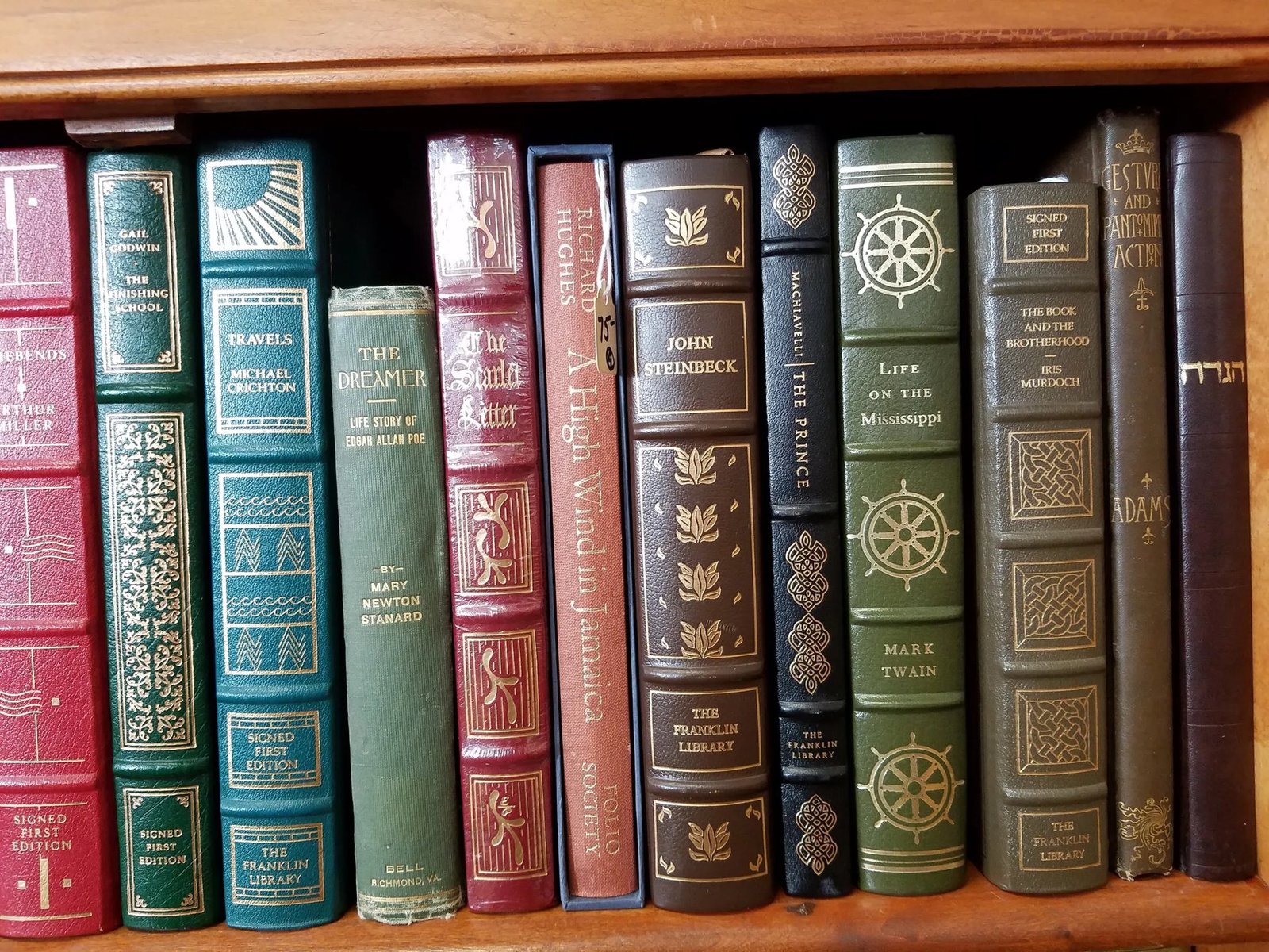 Leather-bound collectible editions on the shelf