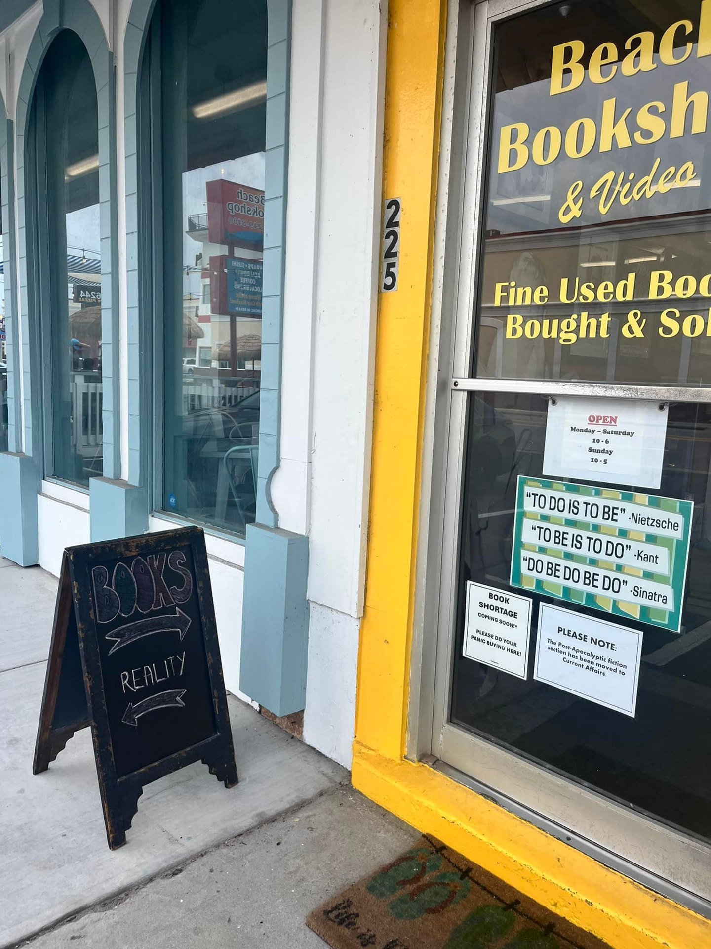 Handwritten window sign about the self-help section